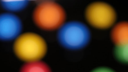 Colorful bokeh lights on black background. Blurred background.の写真素材