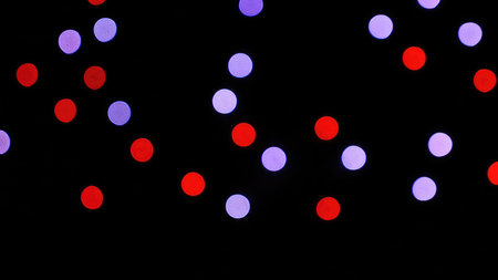 Defocused street lights abstract. City blur background. Moving bokeh circles night traffic
