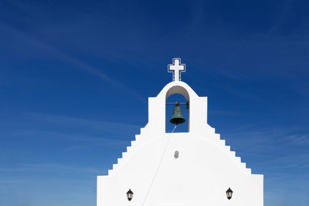 White greek chapel on the blue skyの写真素材