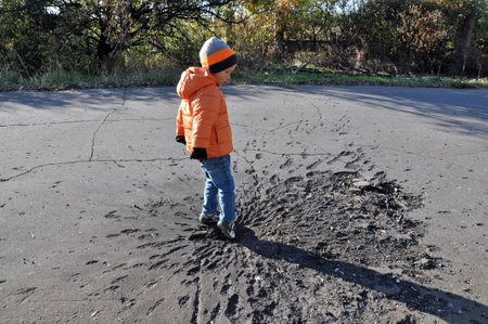 Damage to roads projectile during the armed conflict in the Ukraine. Khartsyzk, Donetsk region.