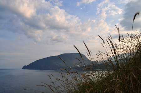 Evening view of the sea, mountains and clouds