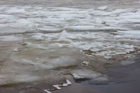 melting of ice blocks in the river water snowの写真素材