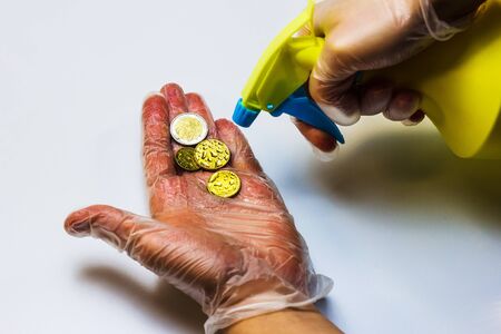 risk of infection virus bacteria through payment money euro and disinfectionの写真素材