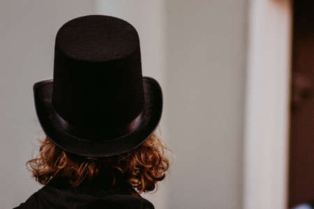mysterious man below with hat on the street young ambient lightの写真素材
