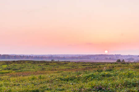 sunset hilly landscape field agriculture nature farmland country view springtimeの写真素材