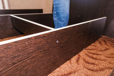 spinning bolts master worker man assembling furniture bed components repair tools easyの写真素材