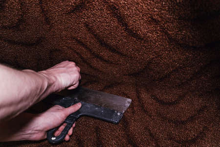 Pruning cutting carpet construction work laying floor sharp blade knife masterの写真素材