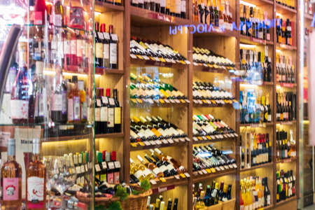 Wine Shop Assortment collection shelves with bottles sale drinks. Russia, Saint-Petersburg, 18mar2021.の写真素材