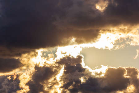 blue clouds with sun large clouds backgroundの写真素材