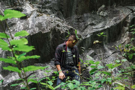 man photographer traveler wanderlust stylish forest mountain canyonの写真素材