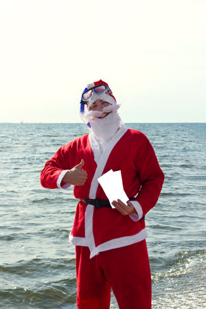 Santa Claus on the Sea with Ticketsの写真素材