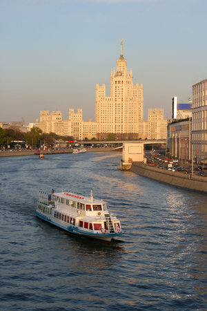 High-altitude building on the quay Kotelnicheskaja, shined by the evening sun.の写真素材