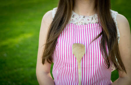 Young housewife with spoon closeupの写真素材