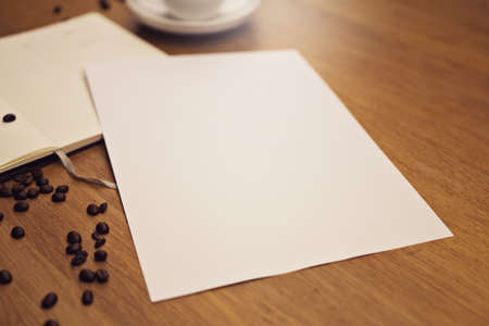 Blank paper with a cup of coffeeの写真素材