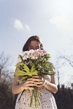 A loved girl holding flowersの写真素材