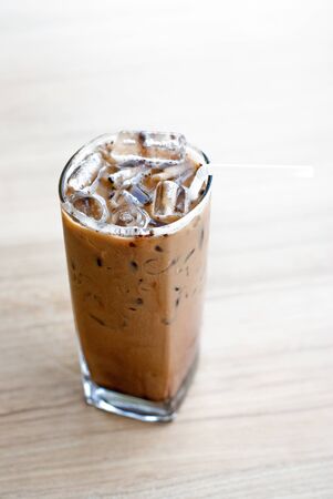 glass of ice coffee on tableの写真素材