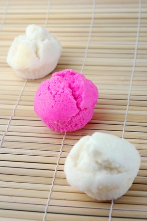 close up pink and white Chinese muffin cake on bamboo matの写真素材
