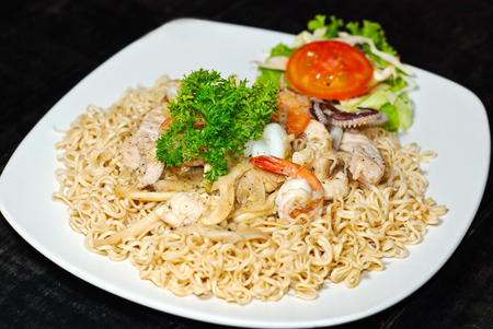stir fried instant noodles with pork and seafoodの写真素材