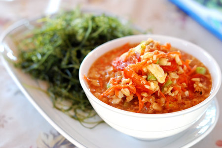 Hot and spicy papya salad with fresh seaweedの写真素材