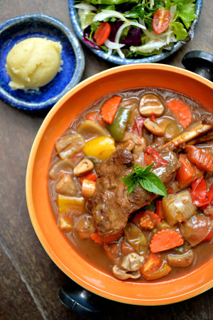 Lamb shank in gravy with mix vegetableの写真素材