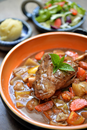 Lamb shank in gravy with mix vegetableの写真素材