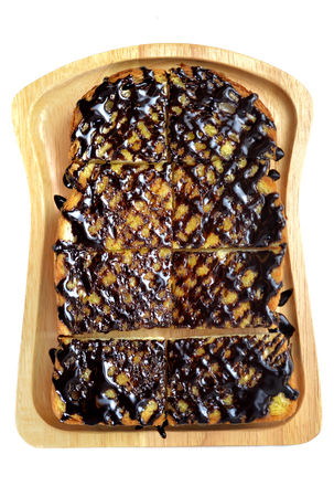 Isolated Toast with chocolate sauce on white backgroundの写真素材