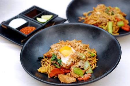 Selective focus of Fry noodle with chicken and egg, Chinese Hokkien styleの写真素材