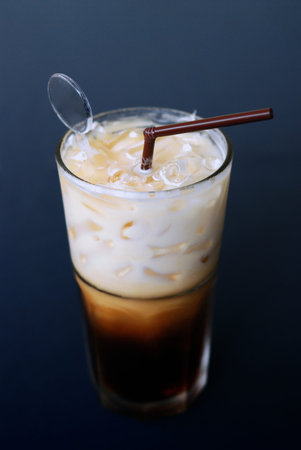 Selective focus cold fresh ice coffee on dark background