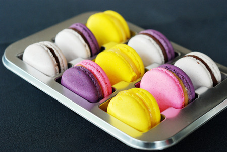 Selective focus of colorful macaroons in boxの写真素材