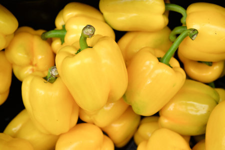 Bell pepper heap in market, natural background