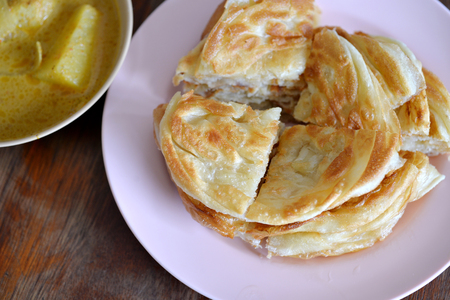 Selective focus of indian bread or roti with curry, Indian foodの写真素材