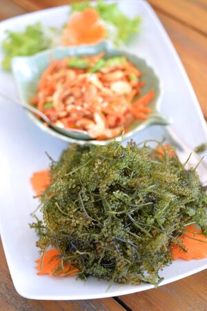 Oval sea grapes seaweed with Spicy Seafood Saladの写真素材