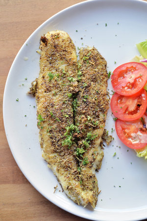 Selective focus of grill fish fillet with herb