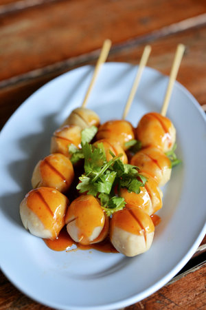 Selective focus of grill pork balls stick with sweet spicy sauceの写真素材