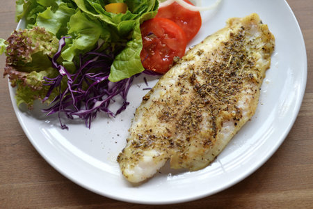Selective focus of grill fish fillet with herb