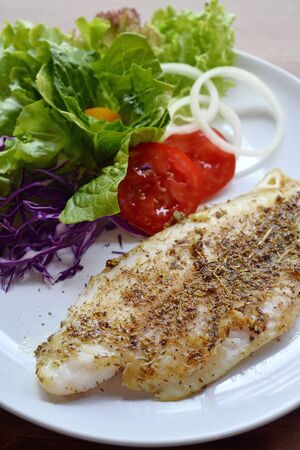 Selective focus of grill fish fillet with herbの写真素材