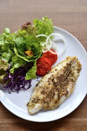 Selective focus of grill fish fillet with herbの写真素材