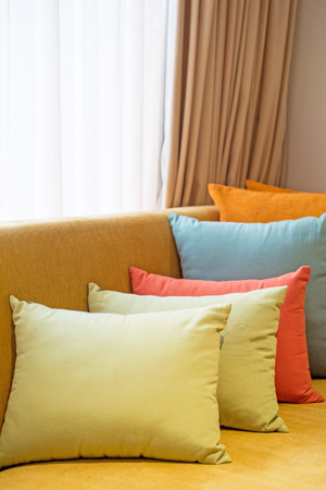 Colorful pillows set in room, selective focusの写真素材