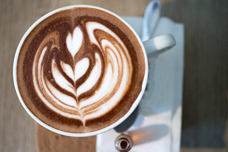 Coffee cup with latte art, selective focus