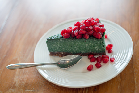 Vegan cake with pomegranate on top, selective focusの写真素材
