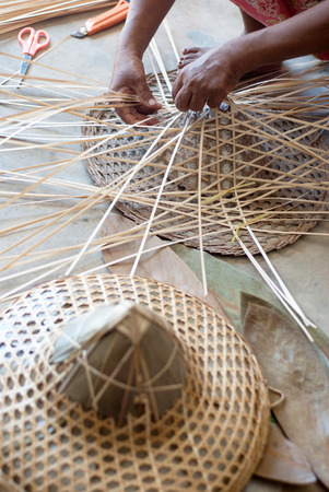 Hand making bamboo hat weaving, selective focusの写真素材