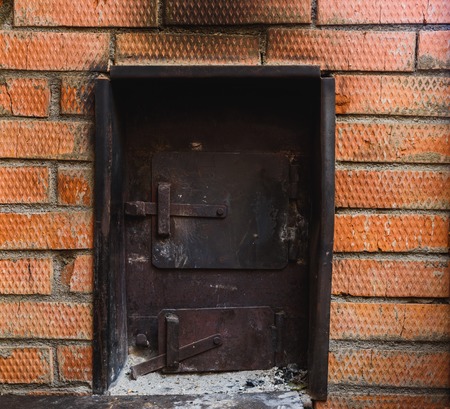 iron stove in the Russian bath lined with red brickの写真素材