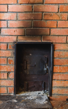 iron stove in the Russian bath lined with red brickの写真素材