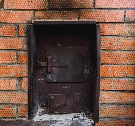 iron stove in the Russian bath lined with red brickの写真素材