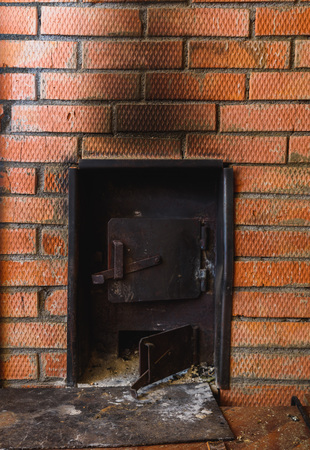iron stove in the Russian bath lined with red brickの写真素材