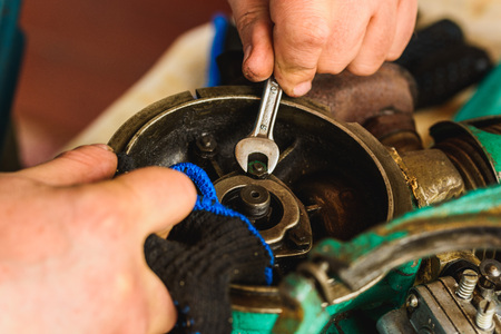 Rusty adjustable wrench and boltの写真素材
