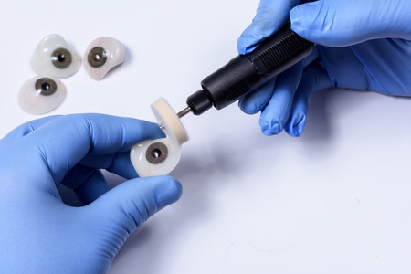 polishing an eye prosthesis in a prosthetic clinicの写真素材
