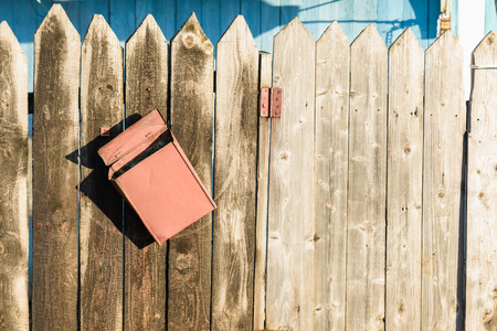 old wooden fence and rusty letter boxの写真素材