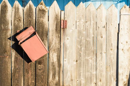 old wooden fence and rusty letter boxの写真素材