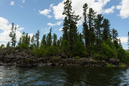 a trip along Teletskoye Lake on a motorboat in the Altai Mountainsの写真素材